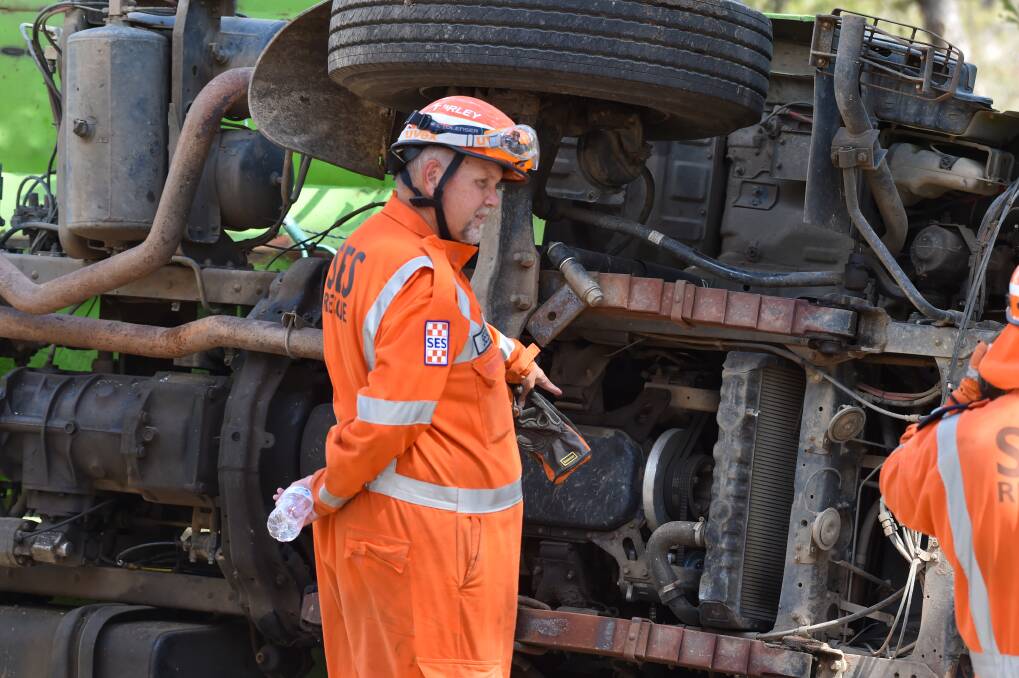 RESCUE: SES crews were on hand to help free the driver from the wreckage. Picture: DARREN HOWE