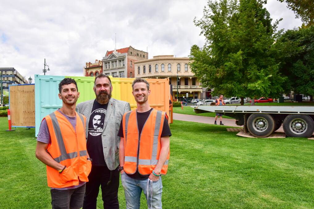 READY: Production designer Ignacio Carreras, Pride festival director John Richardson and creative director Ben Giraud at the the rainbow shipping container in Rosalind Park. Picture: BRENDAN McCARTHY