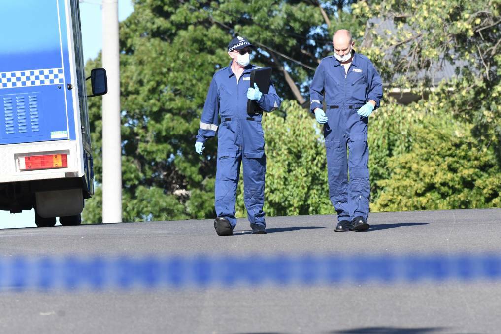 Forensic officers near the scene of the stabbing in King Street on January 3, 2018. Picture: NONI HYETT