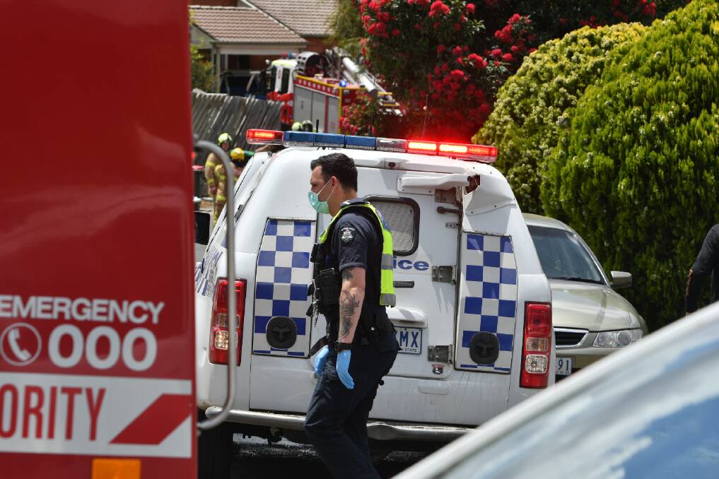 Emergency services respond to a house fire in Eaglehawk. Picture: NONI HYETT
