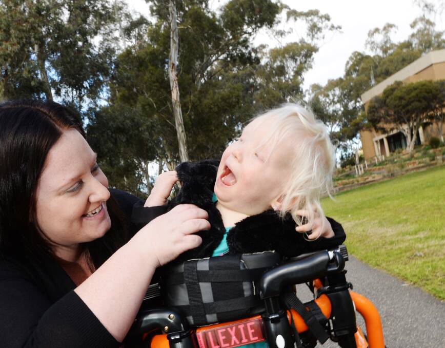 GETTING A MOVE ON: Two-year-old Lexie Eveleigh’s mother Kerrie shared her daughter’s story on Facebook noticeboard page, The Shed. Pictures: DARREN HOWE