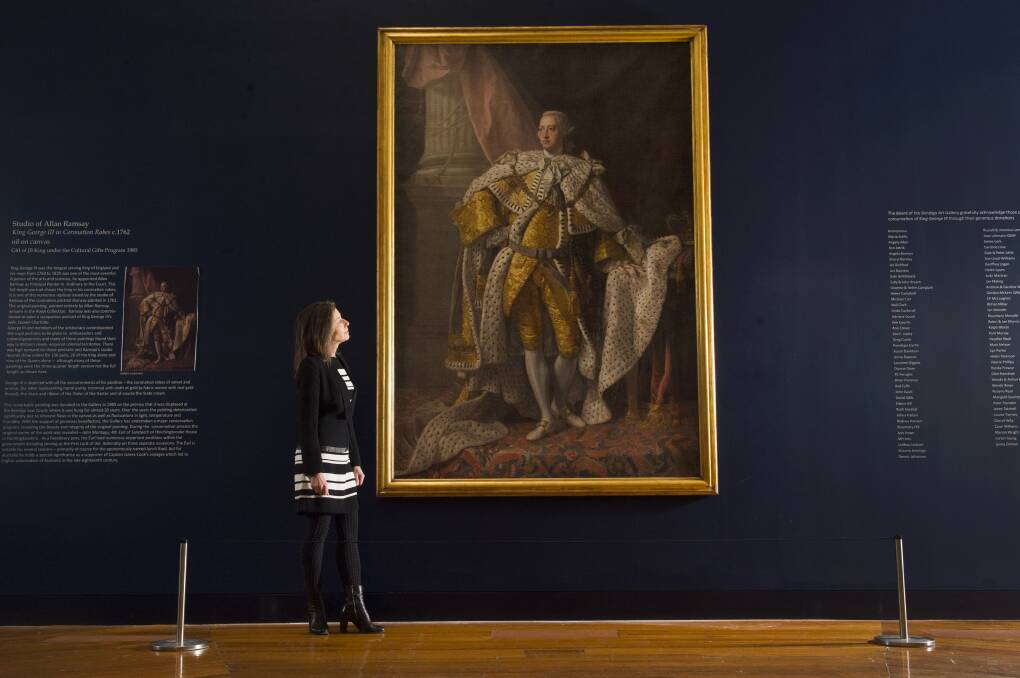 Then art gallery director Karen Quinlan with a picture during the 2019's royal portraits exhibition. Picture: DARREN HOWE