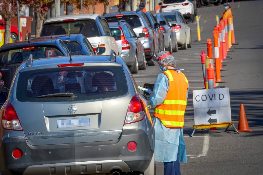 Cars line up for testing in Bendigo after an outbreak in May. Picture: BRENDAN McCARTHY