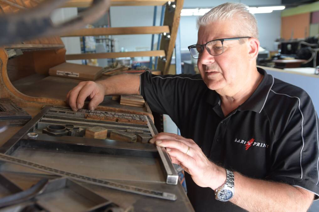 Steve Bright with equipment used in letterpress printing. Picture: NONI HYETT