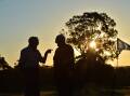 Two people talk on a golf course in the Bendigo area. Picture by Brendan McCarthy