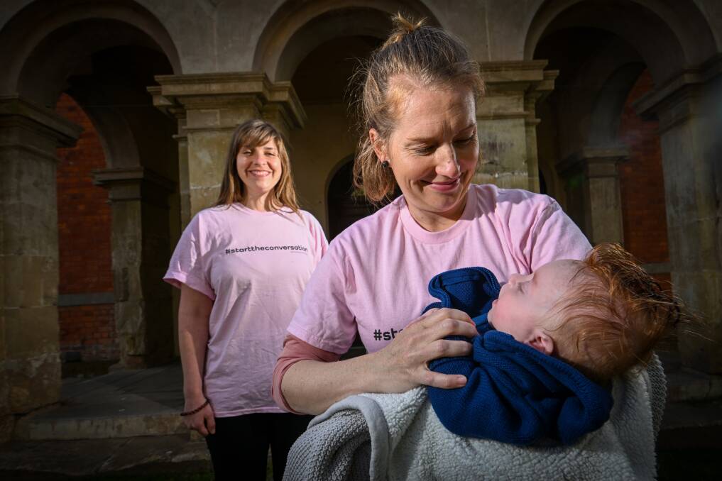 Emma Jenson with her youngest child, Logan, and friend Alicia Huddy. The two mums are organising an exhibition to bring people together after birth trauma. Picture by Darren Howe.