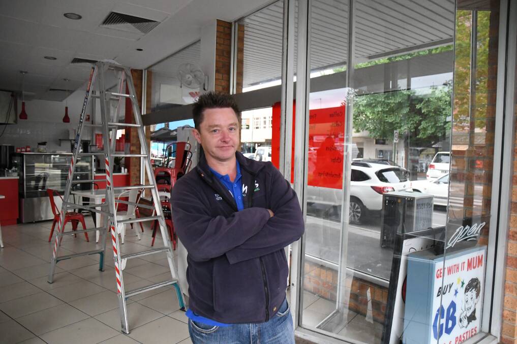 Simon Bush arrived at work Monday morning to find his front doors damaged.