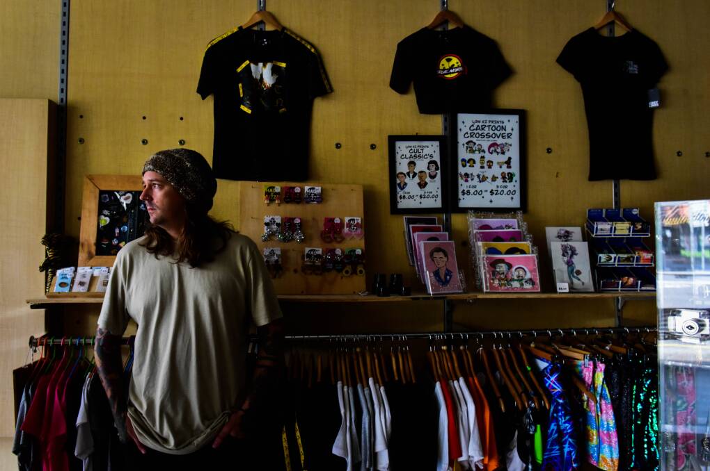 NEW TERRITORY: Jared Farrow is still able to sell clothing, accessories and art, but not out of his Mitchell Street shop front. Picture: BRENDAN McCARTHY
