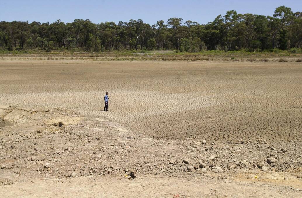 People could walk on the bed of Spring Gully's Number Seven Reservoir in January 2005, during the Millennium Drought. Picture: LAURA SCOTT