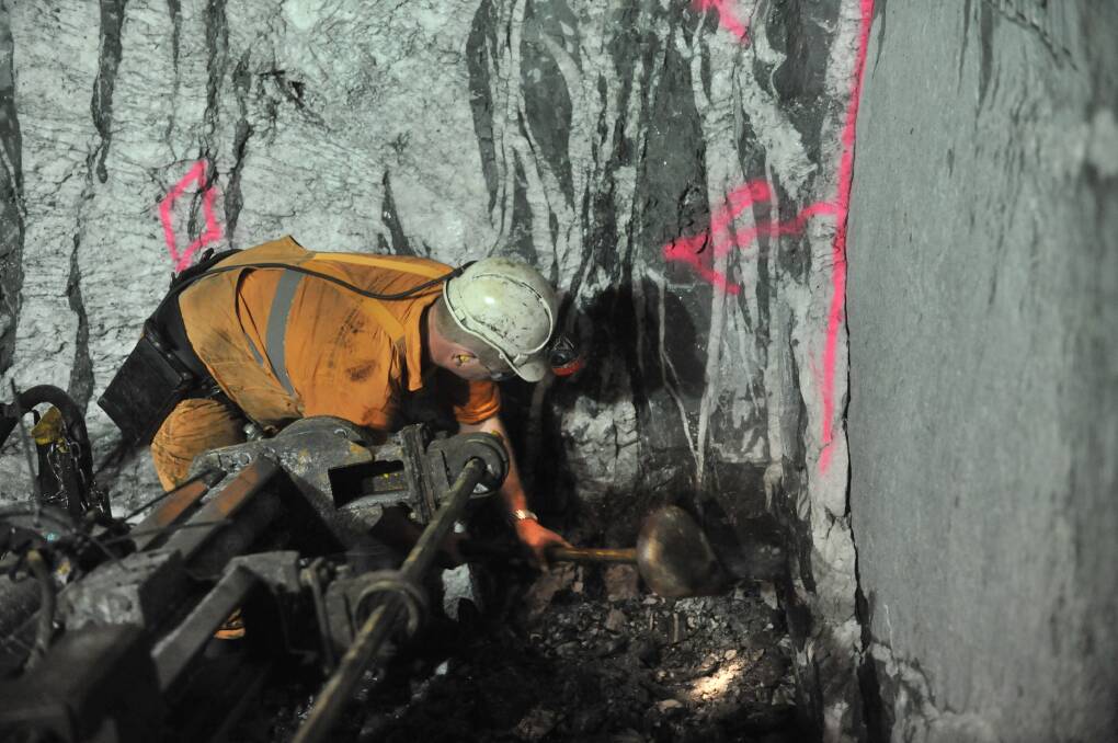 A miner working underground beneath Bendigo in a previous decade. Picture: BILL CONROY