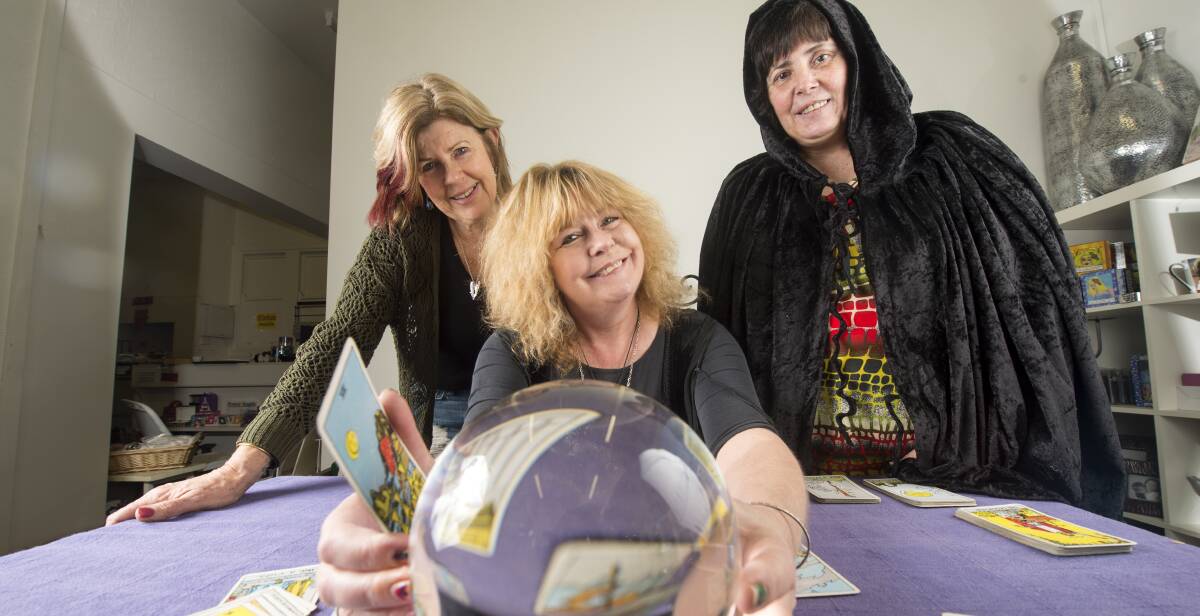 WITCHCRAFT LESSONS: Gaye Washington (centre) shows Bronwyn Griffith and Johanna Hobson the ins and outs of scrying. Picture: DARREN HOWE