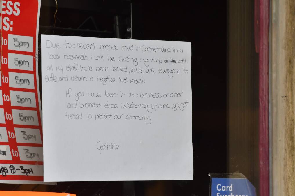 A message to customers on the door of a business in Castlemaine on Sunday. Picture: NONI HYETT
