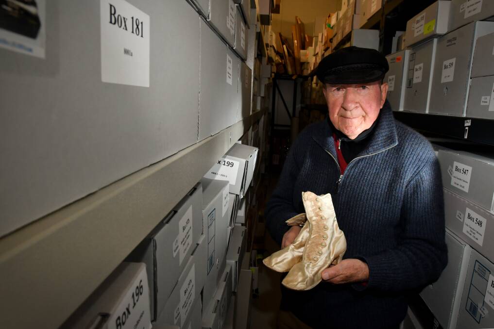 Jim Evans with one of the historical items stored in the Bendigo Historical Society's sprawling collection. Picture: NONI HYETT