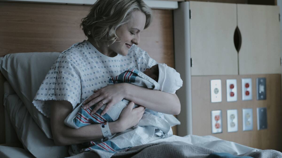 Offred (Elisabeth Moss) has a flashback to the birth of her baby. Photo: George Kraychyk/Hulu