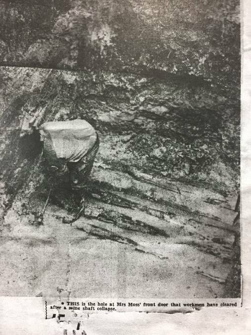 MINE COLLAPSE: Annie Moss at the bottom of a hole workers have cleared outside her California Gully home. Picture: COURTESY OF JOHN KELLY