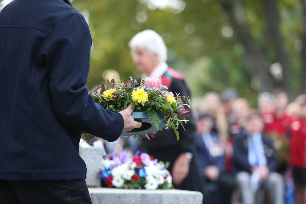 NEVER FORGOTTEN: A crowd honours veterans' service at a 2018 Anzac Day service. Picture: GLENN DANIELS