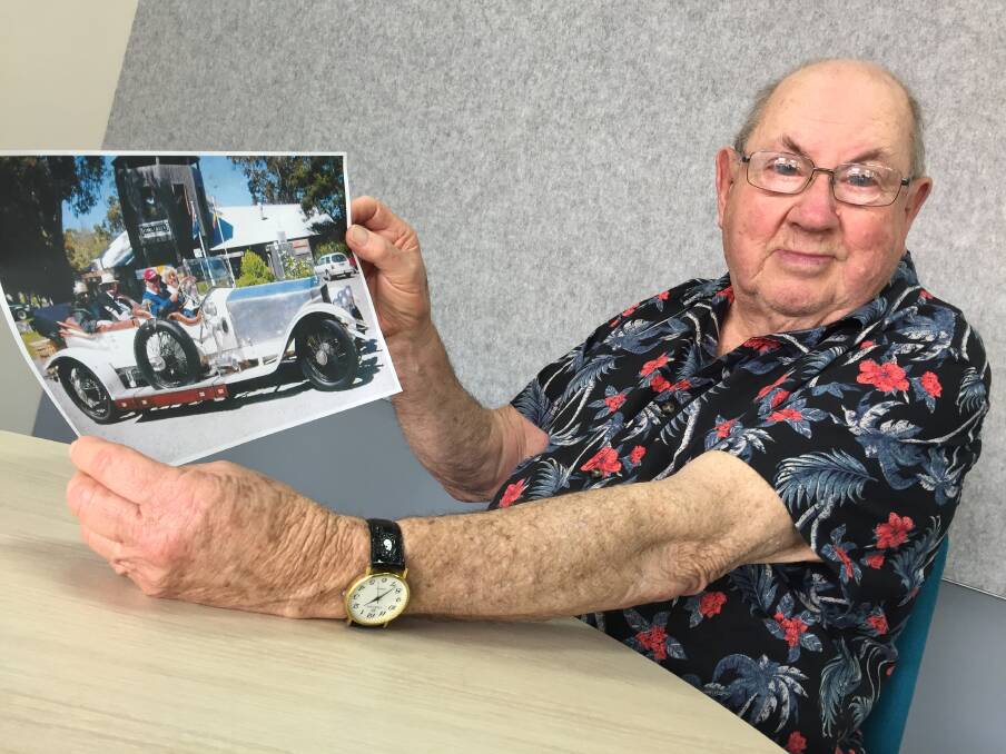 FINALLY FOUND: Dale O'Sullivan with a picture of the car and its current owners. Mr O'Sullivan is a history and automotive enthusiast. 