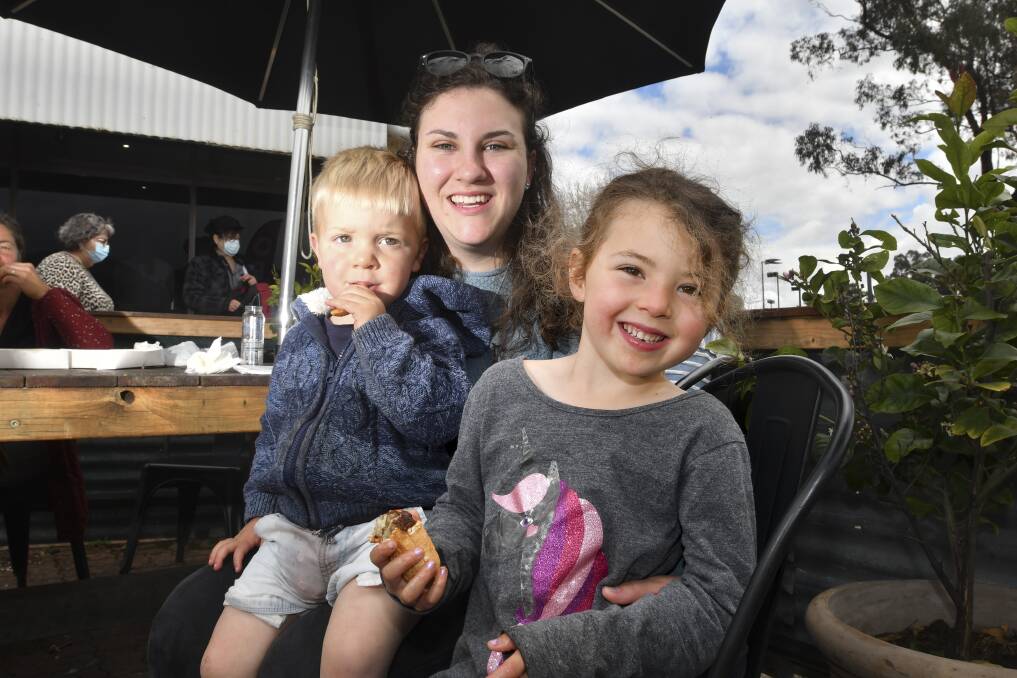 HAPPY CUSTOMERS: Owen Harper, Mel Stretton and Leena Harper at Mick's Fresh Fish after the business suffered a COVID scare and went through deep cleaning. Picture: NONI HYETT