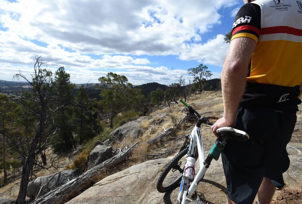 READY TO ROLL: A mountain bike rider enjoys the scenery at a park near Harcourt. Central Victorian bushland has been reopened but some areas have closed because people are not social distancing: JODIE DONNELLAN