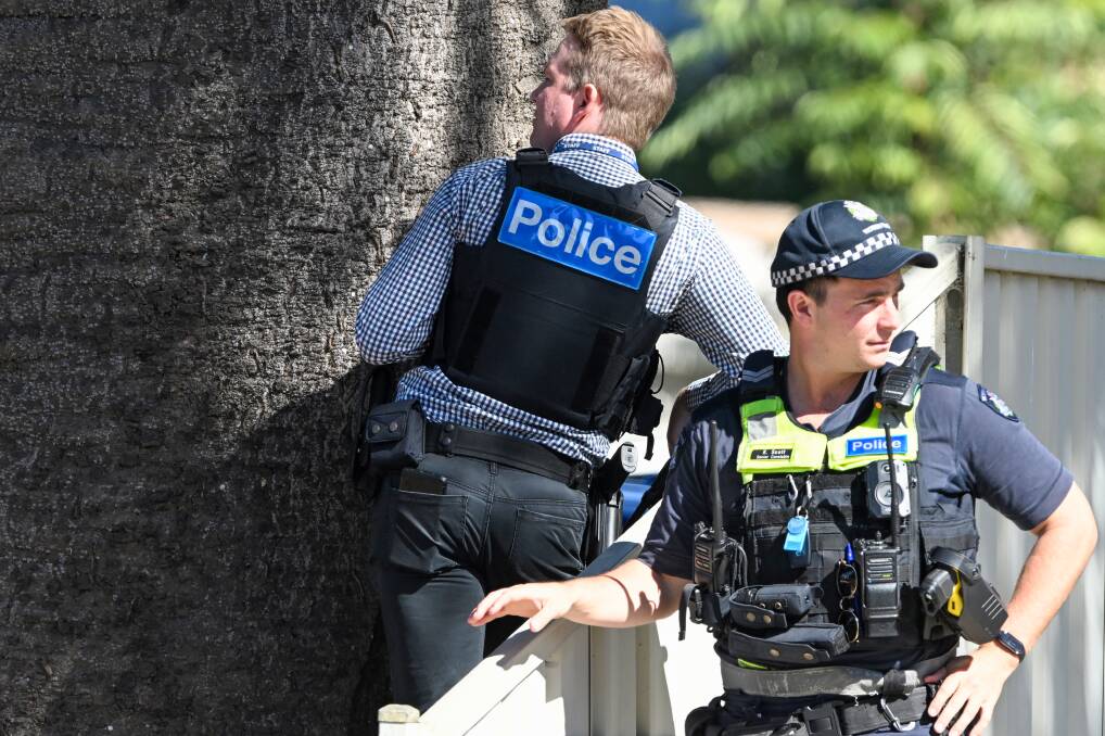 Police officers at a siege in Water Street, Bendigo. Picture by Darren Howe