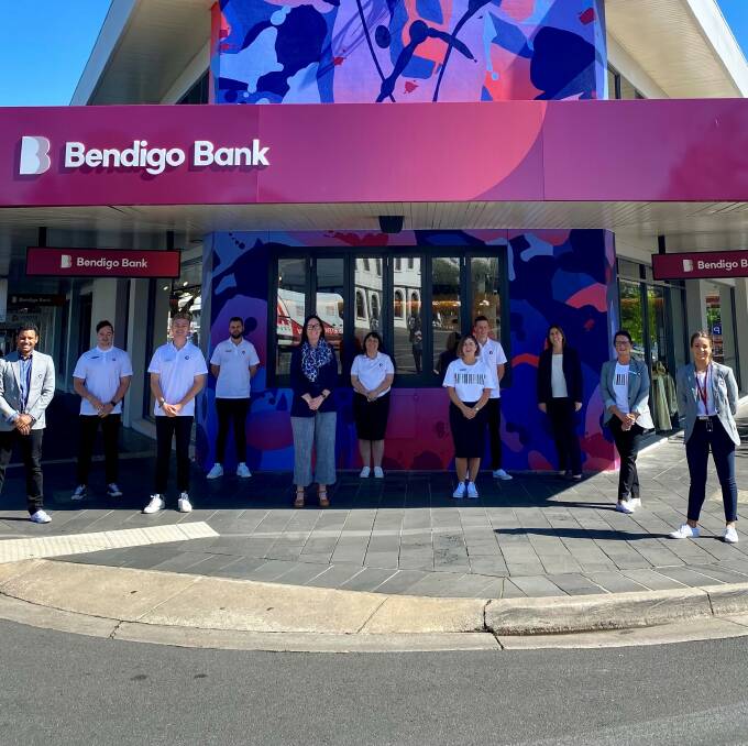 Marnie Baker, managing director, Bendigo Bank (back right), Justine Minne, state manager regional Victoria and Tasmania, (front centre), and members of the Bendigo Bank Mitchell Street branch team, pictured outside the newly revamped branch of the future which opened its doors to the public this morning.Picture: SUPPLIED