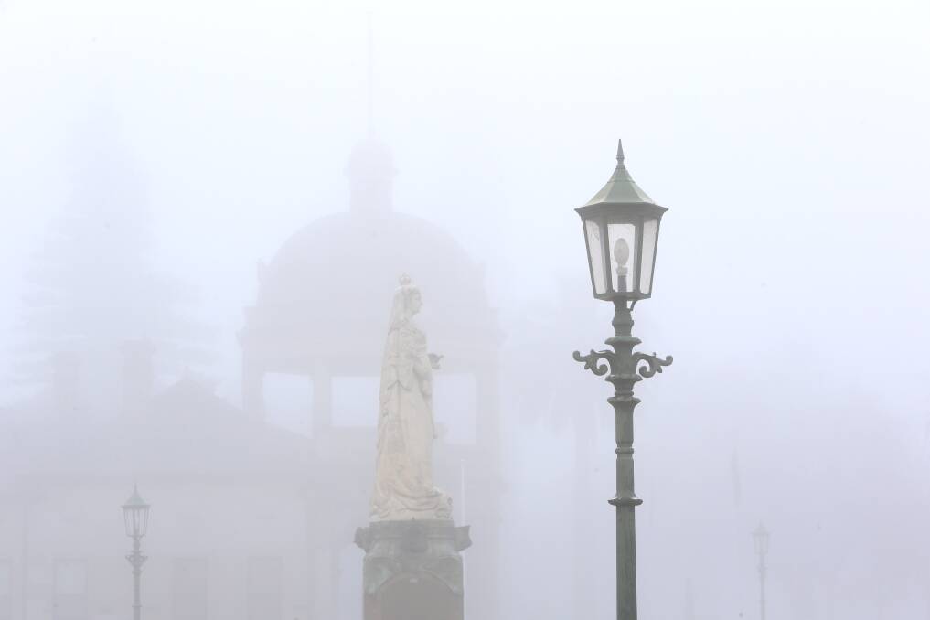 LIFE AND DEATH: A statue of Queen Victoria is enveloped by fog in Bendigo and (below) the first lines of a Bendigo Advertiser story from 1875. Images: PETER WEAVING and TROVE