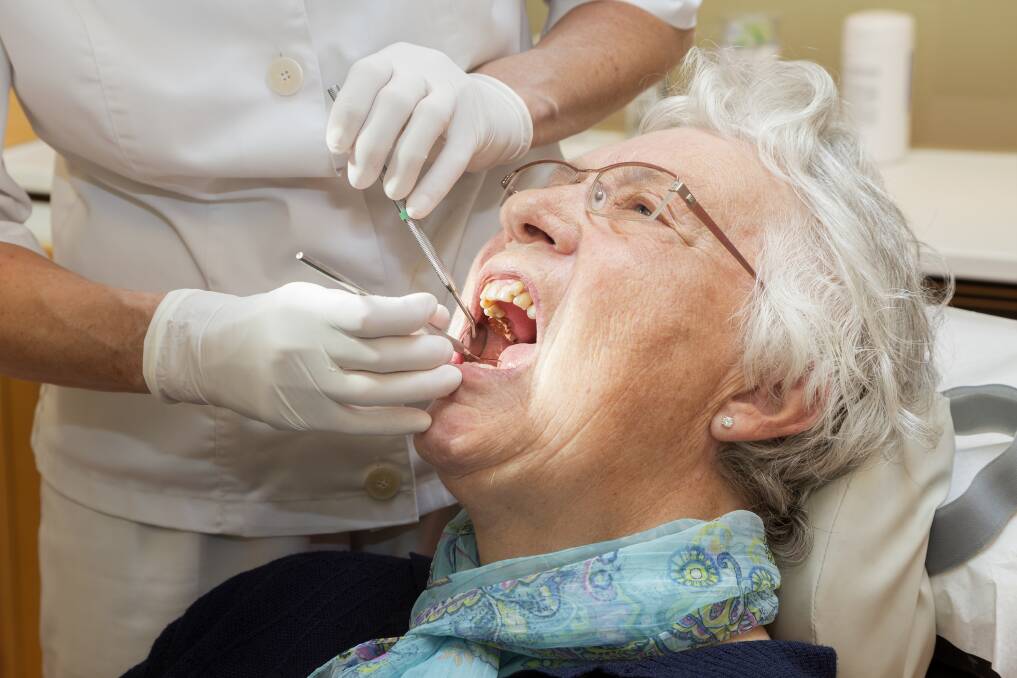 A dentist checks someone's teeth. Picture: SHUTTERSTOCK
