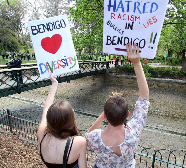 Counter protesters hold up signs as anti-Mosque advocates gathered in Rosalind Park in October, 2015. Picture: GLENN DANIELS