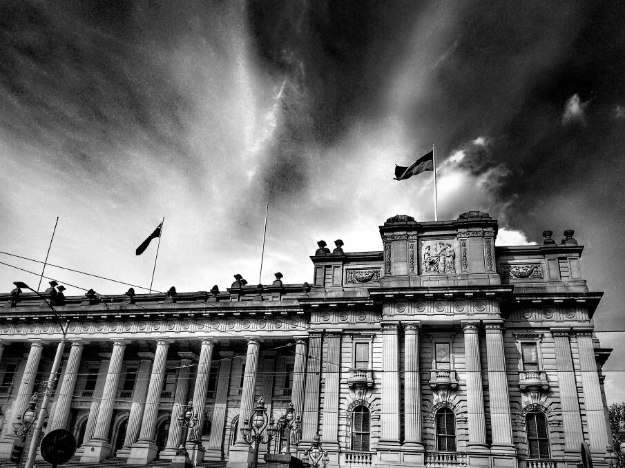 COLONIAL BATTLEGROUND: Storm clouds gather over Victoria's parliament house. The building was a seething pit of intrigue as politicians built and destroyed brittle alliances in the 19th century. Picture: GETTY IMAGES