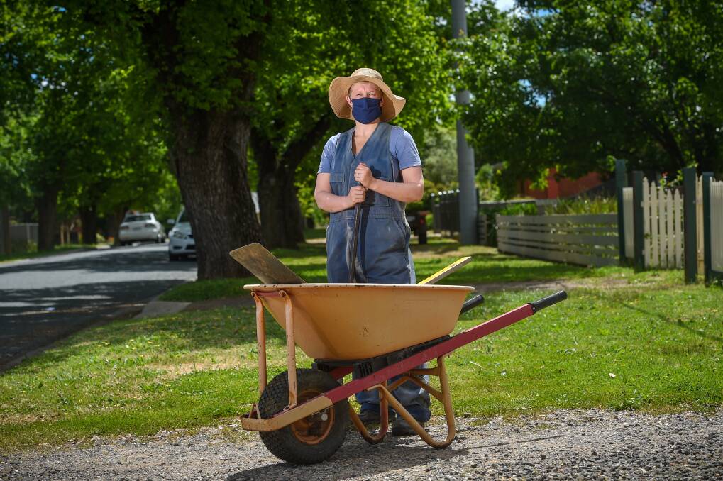 DIGGING INTO COMMUNITY: Clare Dullard is happy for neighbours to borrow her wheelbarrow using a new Bendigo-built and owned social media app. The bHive social media platform is soon to launch but is already open to residents with something to share. Picture: DARREN HOWE