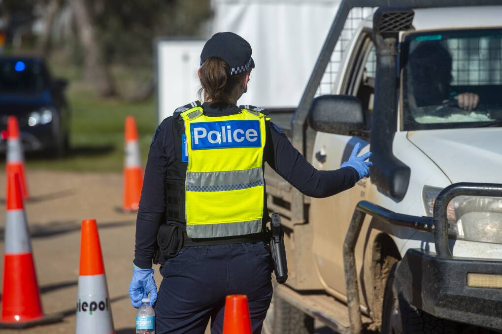A police officer prepares stops a ute. Picture: FILE PHOTO