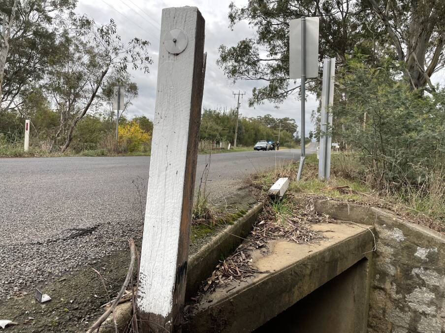 A white pole lies on the side of Somerset Part Road, next to a sign. Both were damaged when a motocyclist crashed in Strathfieldsaye on Friday. Picture: TOM O'CALLAGHAN