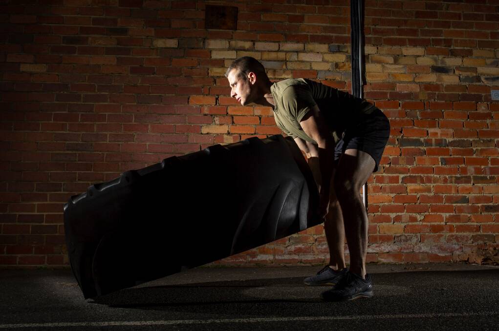 Jayce Bassett will flip a 60 kilogram tyre up the hill this weekend. Picture: DARREN HOWE