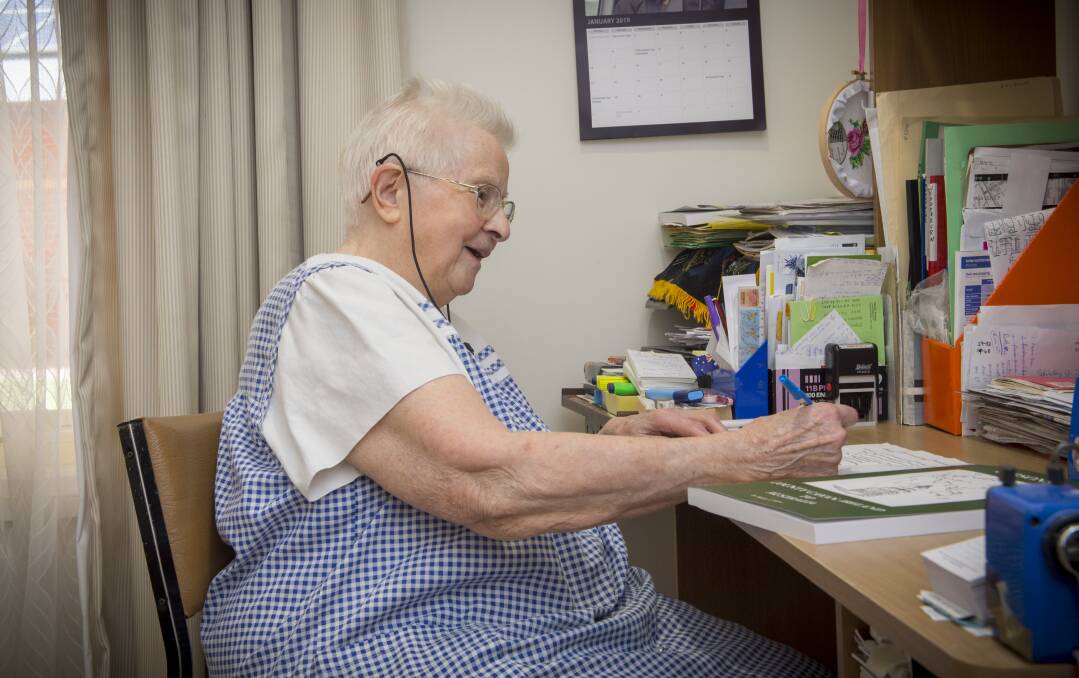 WORDSMITH: Shirley Stone at her desk. Picture: DARREN HOWE