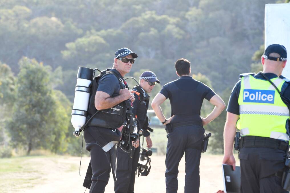 Police divers prepare equipment before recovering a body at Turpins Falls earlier this year. Picture: NONI HYETT