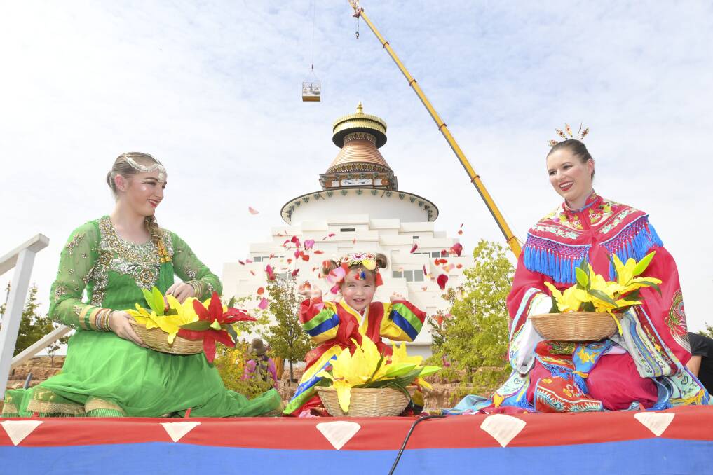 Georgia Skinner, two-year-old Seraphina Graham and her mother Mirriam in January, when exterior construction on the Great Stupa ended. Picture: NONI HYETT