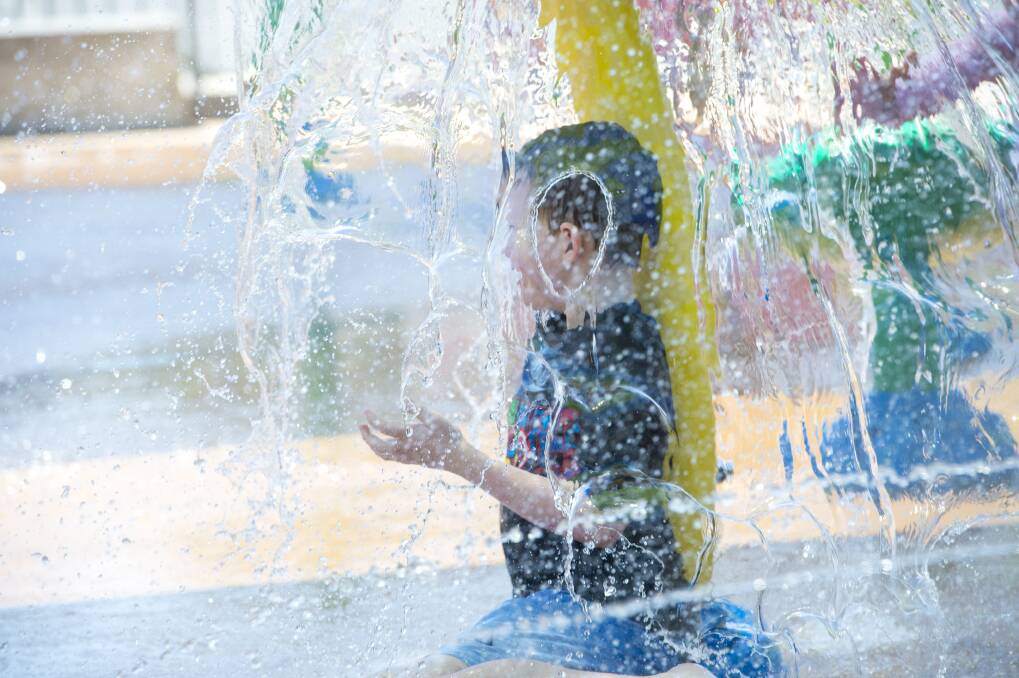 TIME FOR A DIP: Oscar Williams cools off on a scorching day at the Eaglehawk Splash Park earlier this year. Today could see the hottest ever December day in Bendigo. Picture: DARREN HOWE
