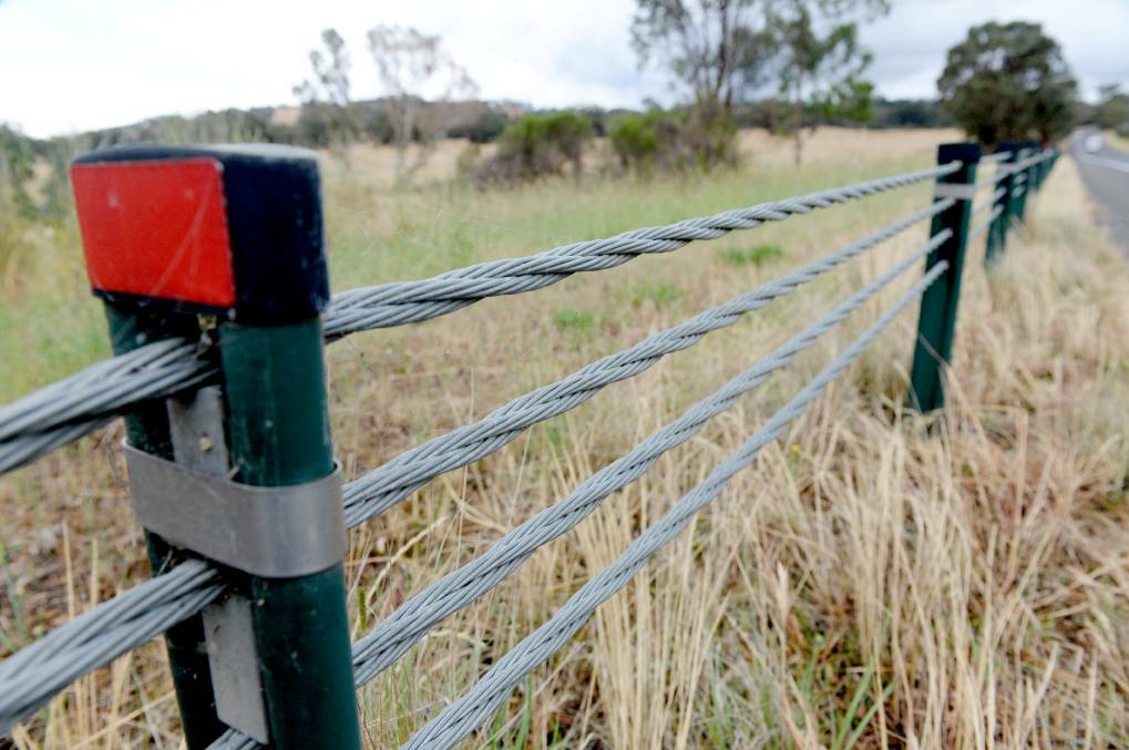 PROTECTION: The state government says a wire rope barrier roll-out is saving lives. Others are not so sure. Picture: DARREN HOWE