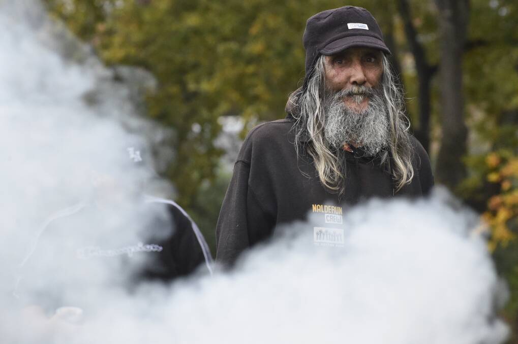 TIME FOR HARD CONVERSATIONS: Uncle Rick Nelson at a smoking ceremony marking National Sorry Day in Castlemaine. Picture: NONI HYETT