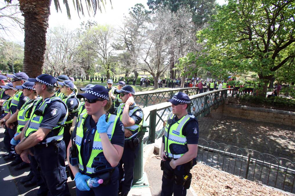 TOLERANCE NEEDED: Police form a human barrier between far right protesters and counter protesters at Rosalind Park, a place no-one had a problem with Muslims praying a century earlier. Picture: GLENN DANIELS