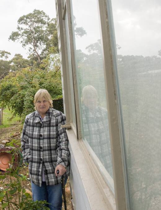 Debbie Comini has bubble wrapped a number of windows at her Ravenswood property to muffle sound from a neighbouring rest stop. Picture: DARREN HOWE