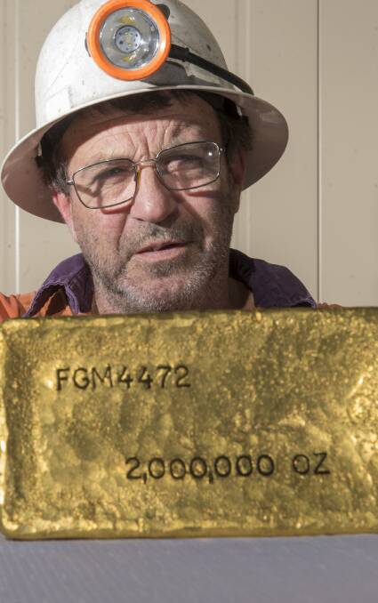 Miner Leroy Begelhole with a gold bar marking the two millionth ounce of gold mined at Fosterville's mine in 2019. Picture: DARREN HOWE