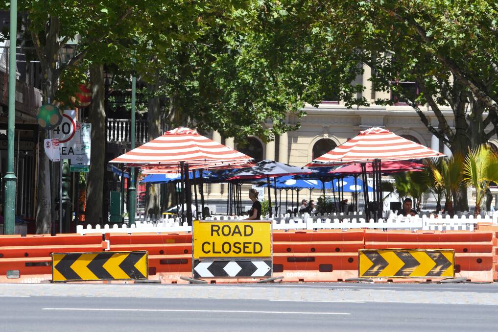 The view into Bull Street on Friday as restaurants prepared for a weekend of trade. Picture: NONI HYETT