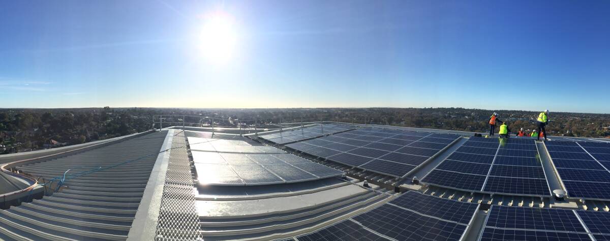 Solar panels being installed on a hospital roof in the Loddon Mallee region. Picture: JASON WALLS
