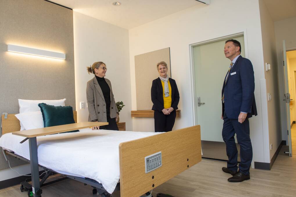 NEW HOME: State parliamentarians Jacinta Allan and Maree Edwards inspect new aged care rooms at Golden Oaks with Bendigo Health's Bob Cameron. Picture: DARREN HOWE