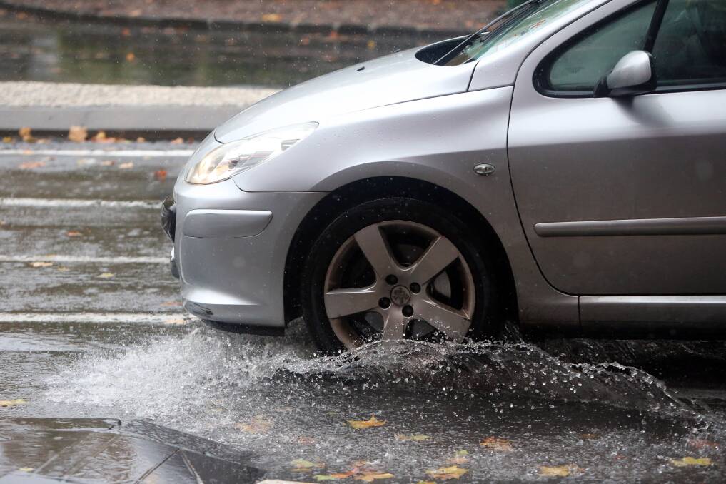 A car negotiates heavy rain in Bendigo. Picture: GLENN DANIELS
