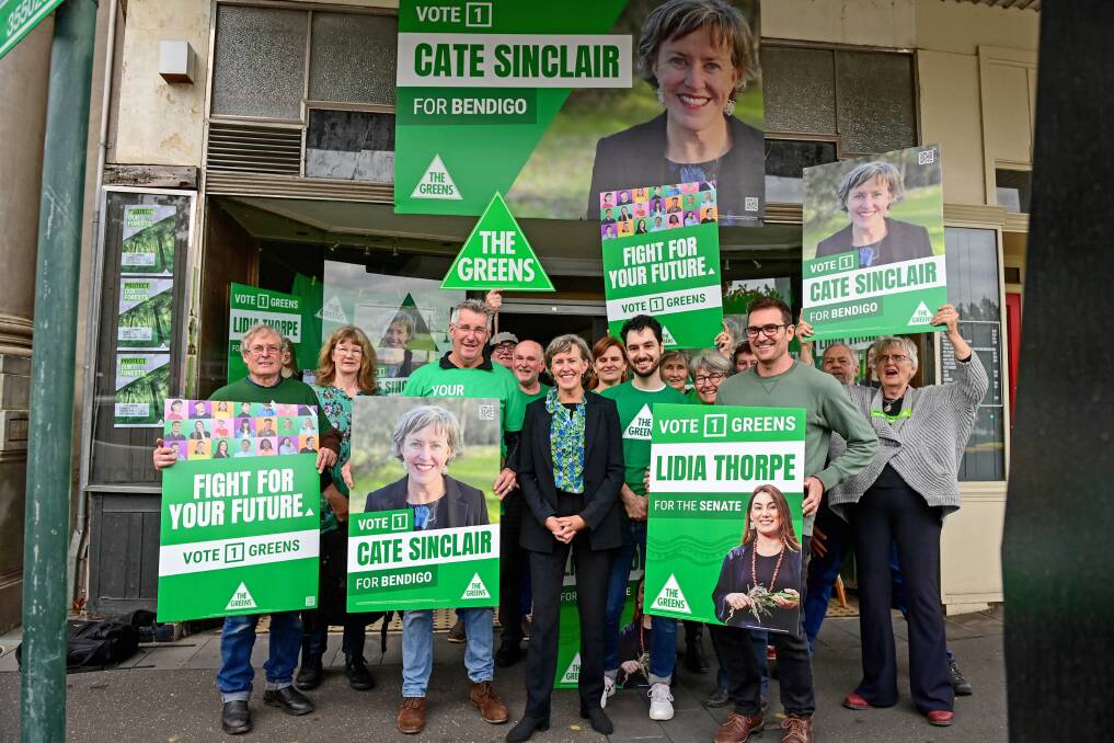 EVERYBODY SAY 'HUNG PARLIAMENT': Greens supporters gather with Bendigo candidate Cate Sinclair. Picture: BRENDAN McCARTHY