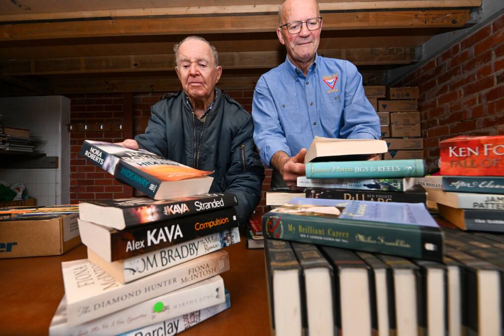 Alan Campbell and Peter Searle are among the dedicated volunteers who have helped make Y Service Club book sales so successful over the years. Picture by Darren Howe.