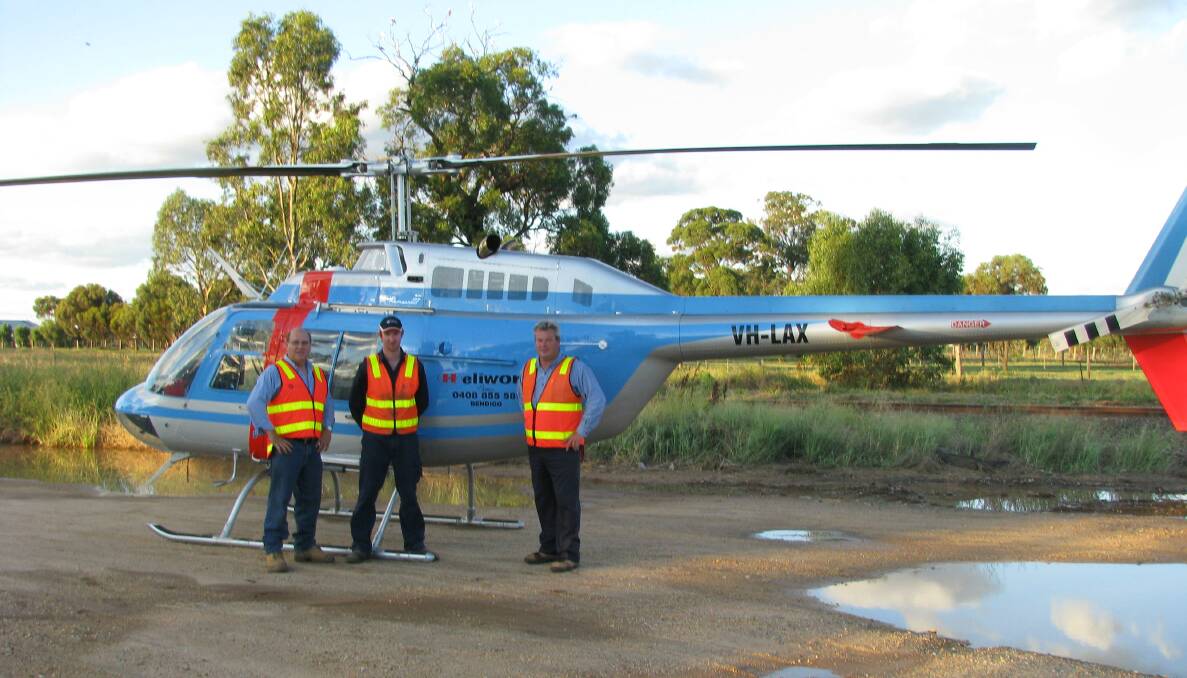 John Wright, Paul Beard and Adam Moss in Bridgewater during the January 2011 Floods when working for Campaspe Asset Management Services, Coliban Waters previous Operations and Maintenance contractors. Picture: SUPPLIED