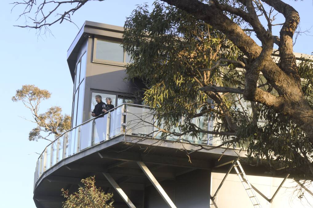 GREAT VIEW: Peregrine Ridge's owners Graeme Quigley and Sue Kerrison look out from their new wine cellar atop a ridge in the Mount Camel range. Picture: NONI HYETT